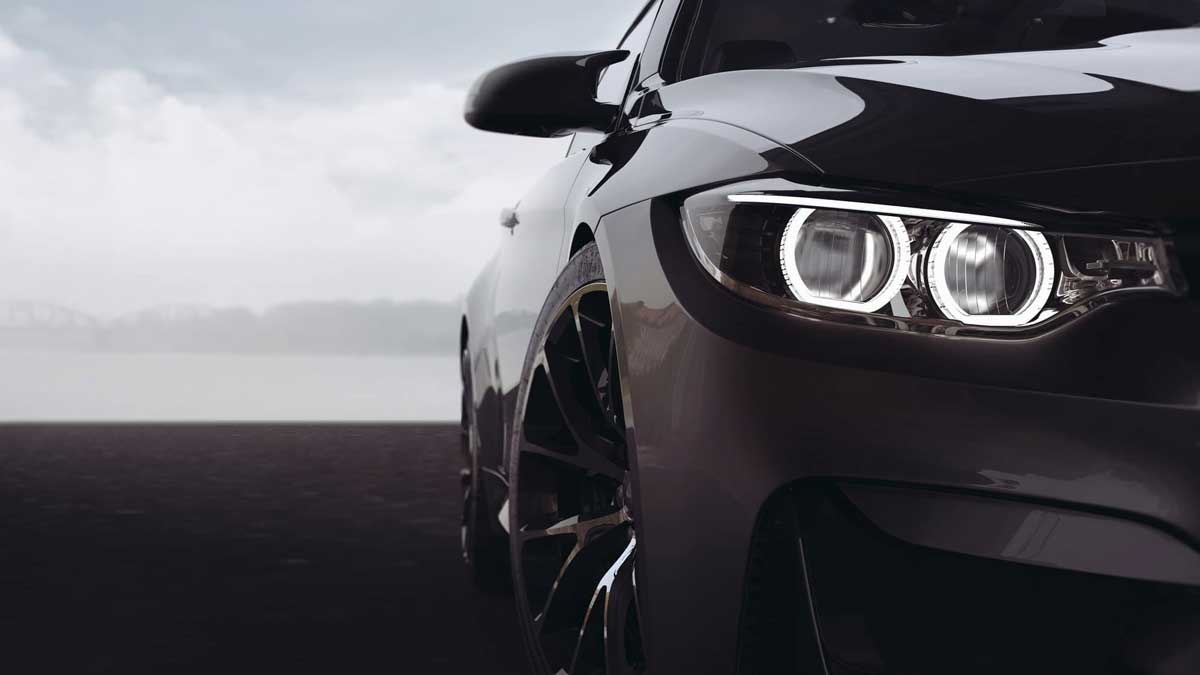 Photo of a black BMW car focused on the headlights