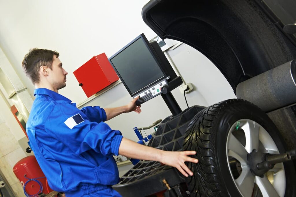 Mechanic checking tire