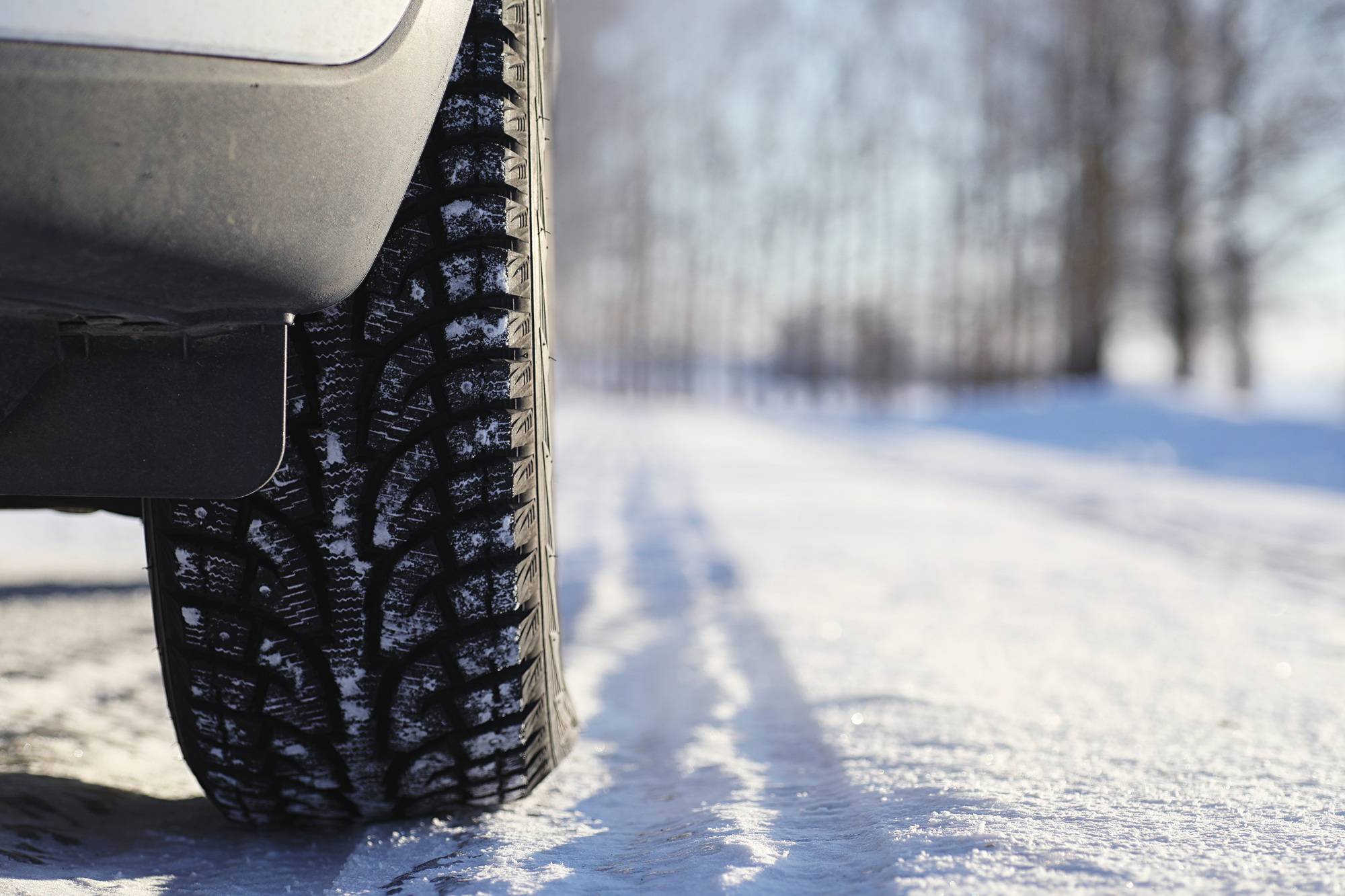 Winter road and a car